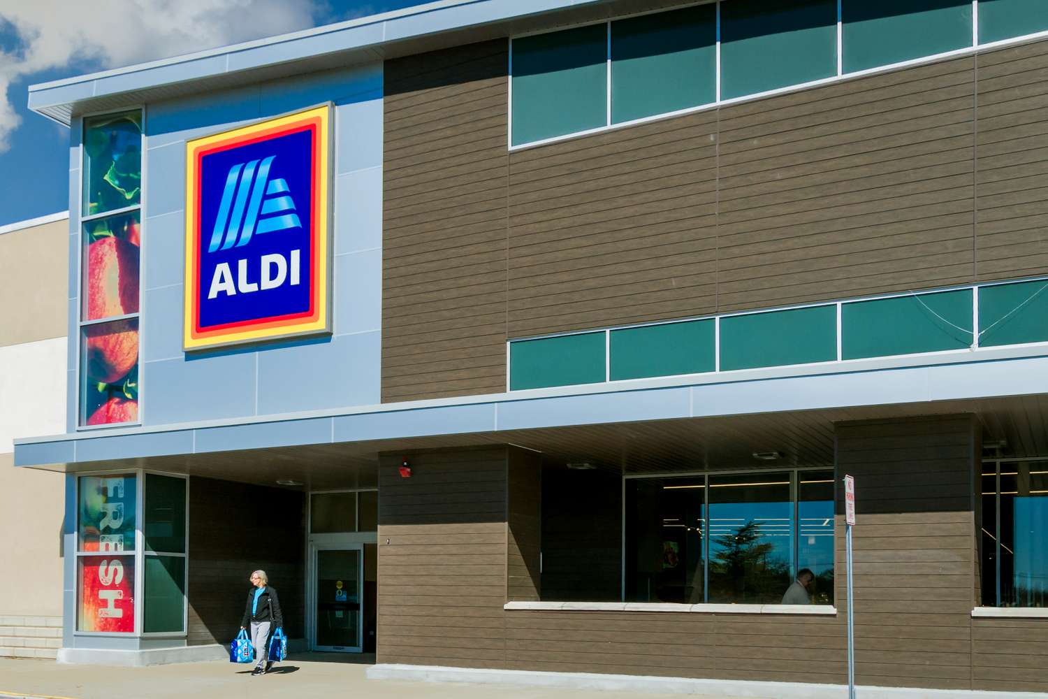 Exterior view of an Aldi supermarket, featuring the store entrance and logo