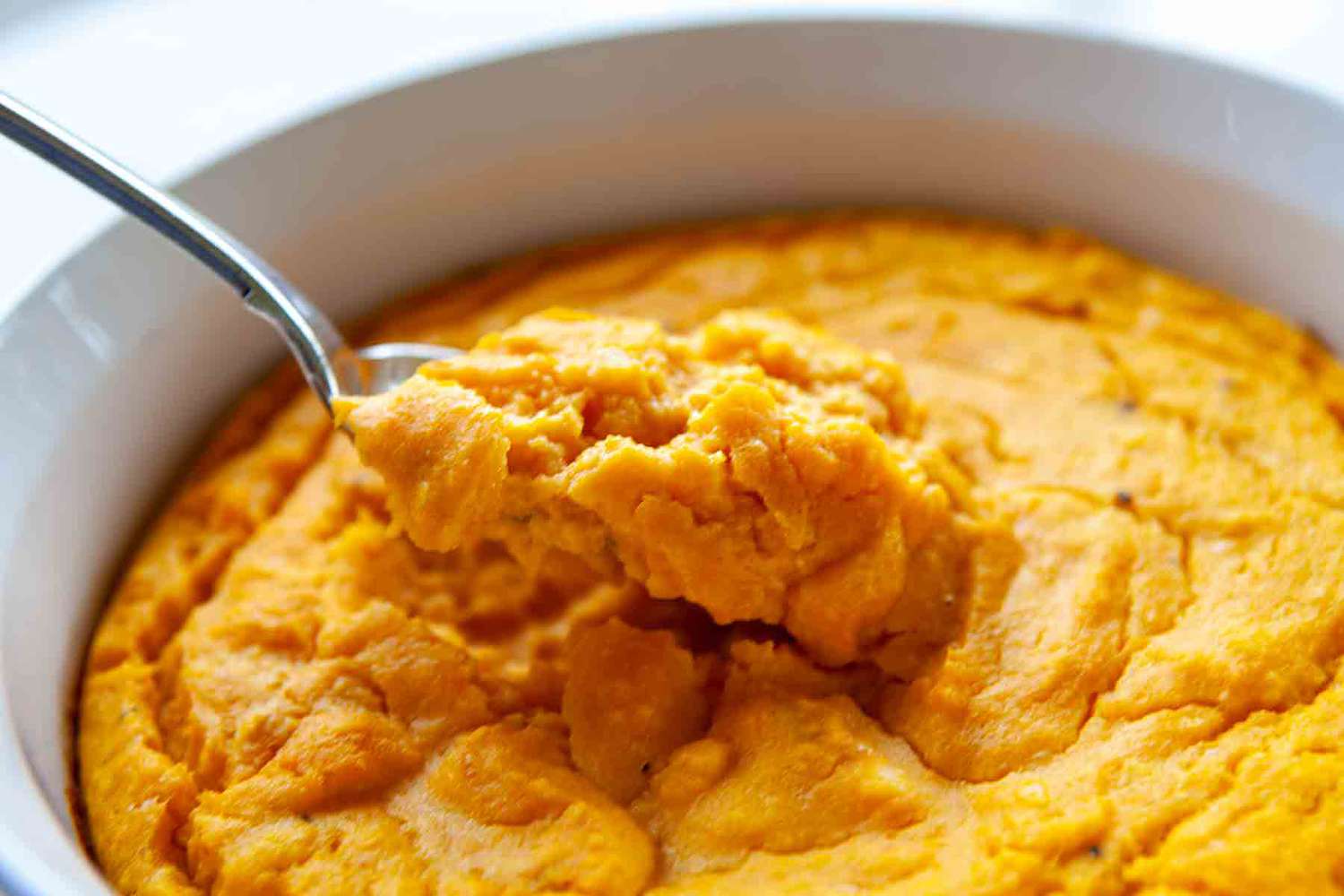 Spoon Scooping up Some Carrot Soufflé 