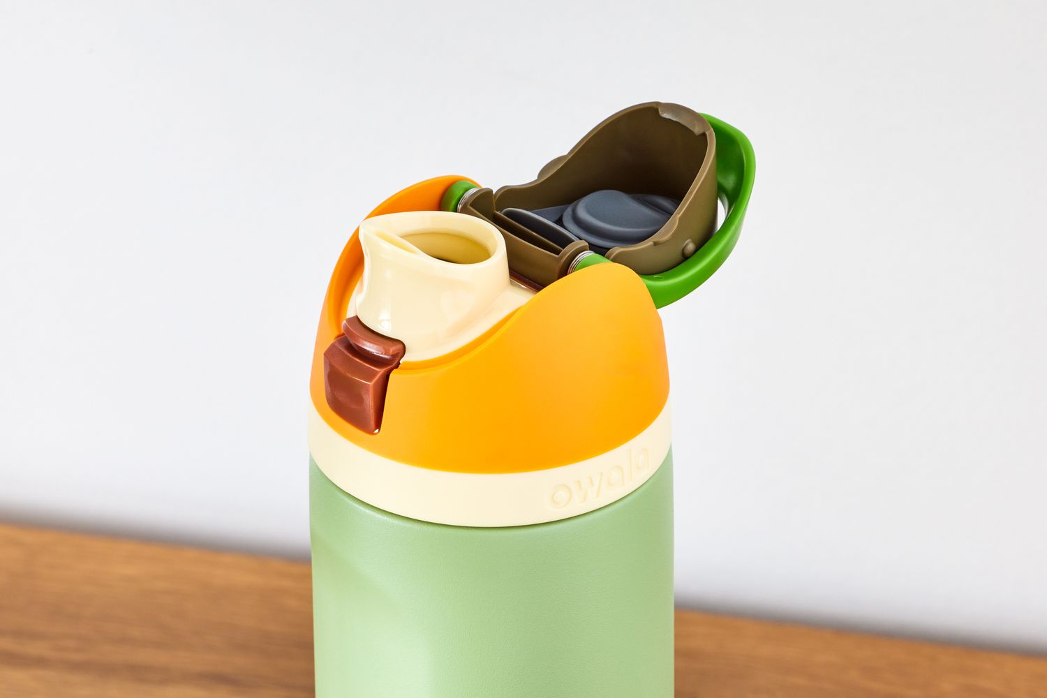 The open cap of a Owala Freesip insulated stainless steel water bottle.