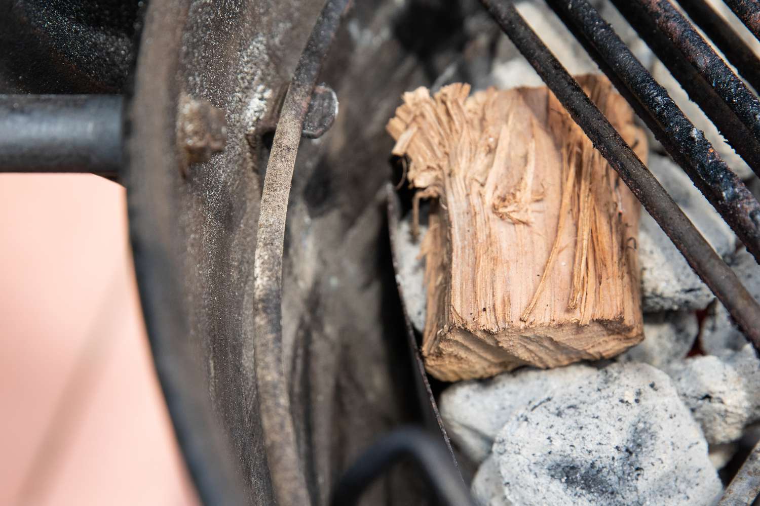Preparing the grill to make apple and sage-brined smoked turkey breast.