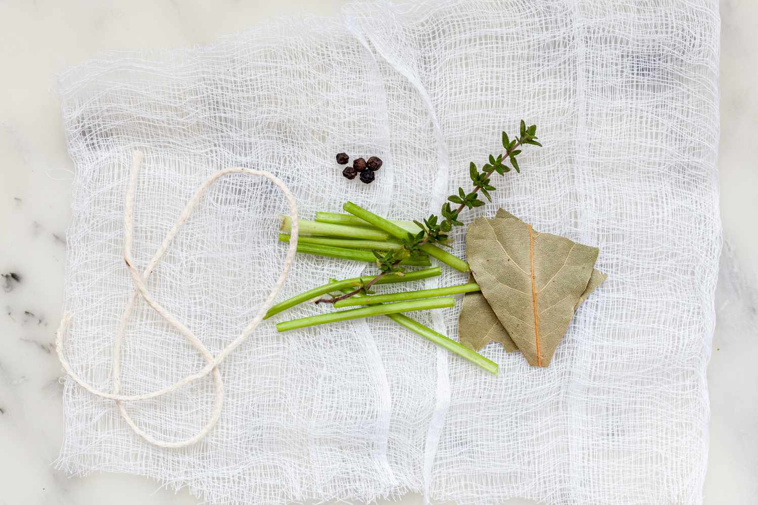Herbs, string, and cheese cloth for classic demi-glace sauce 