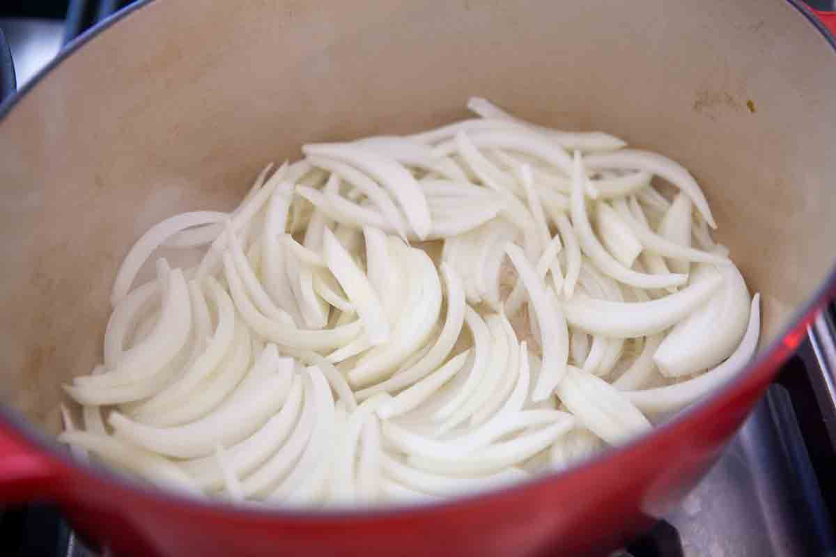 sliced onions in dutch oven for panade