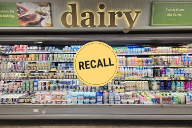 Supermarket dairy section with a recall notice displayed