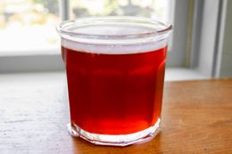 A jar of quince jelly glinting in the sun