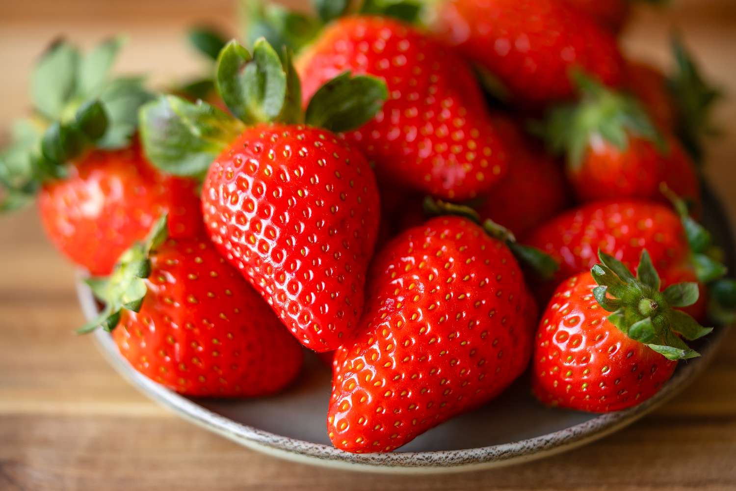 A plate with fresh strawberries