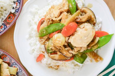 Moo Goo Gai Pan Chicken on a white plate with rice