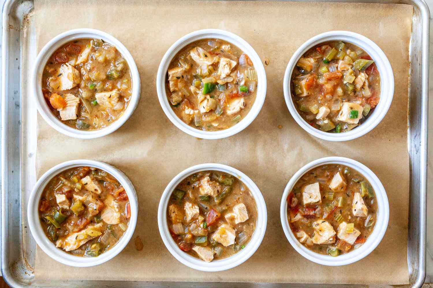 Filled ramekins with turkey pot pie.