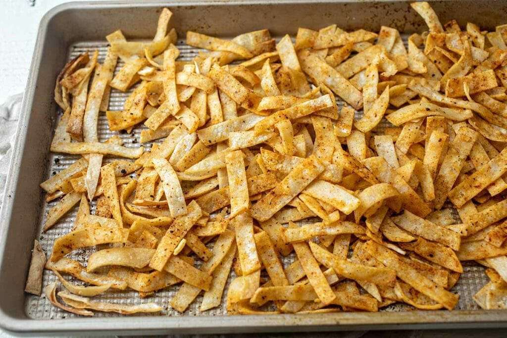 Bake the tortilla strips on a baking sheet until they're nice and crispy.