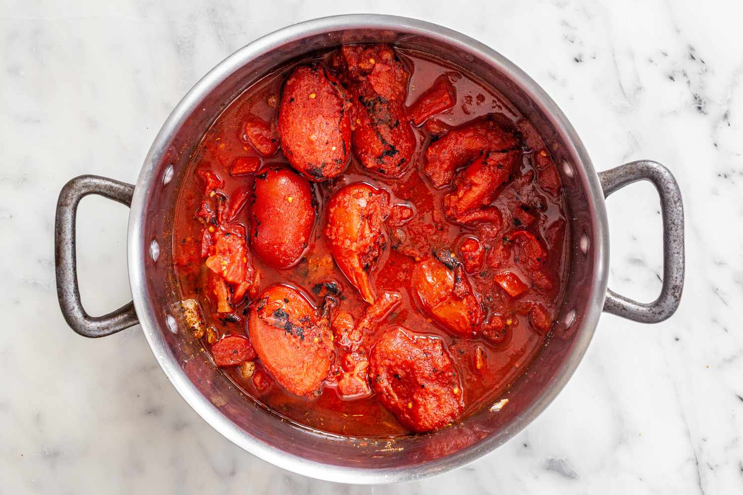 Canned Tomatoes Added to the Pot for Chicken Enchilada Soup Recipe