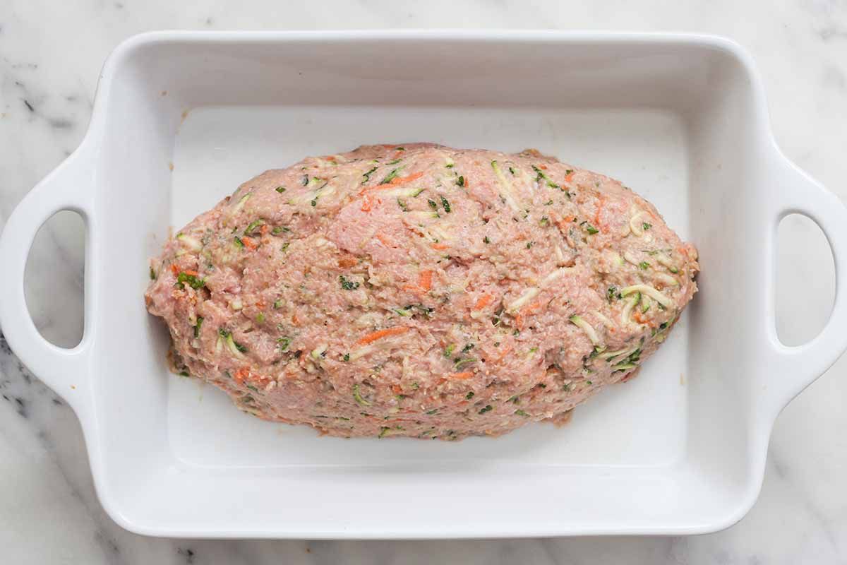 Turkey Meatloaf shaped like a football and in a casserole dish