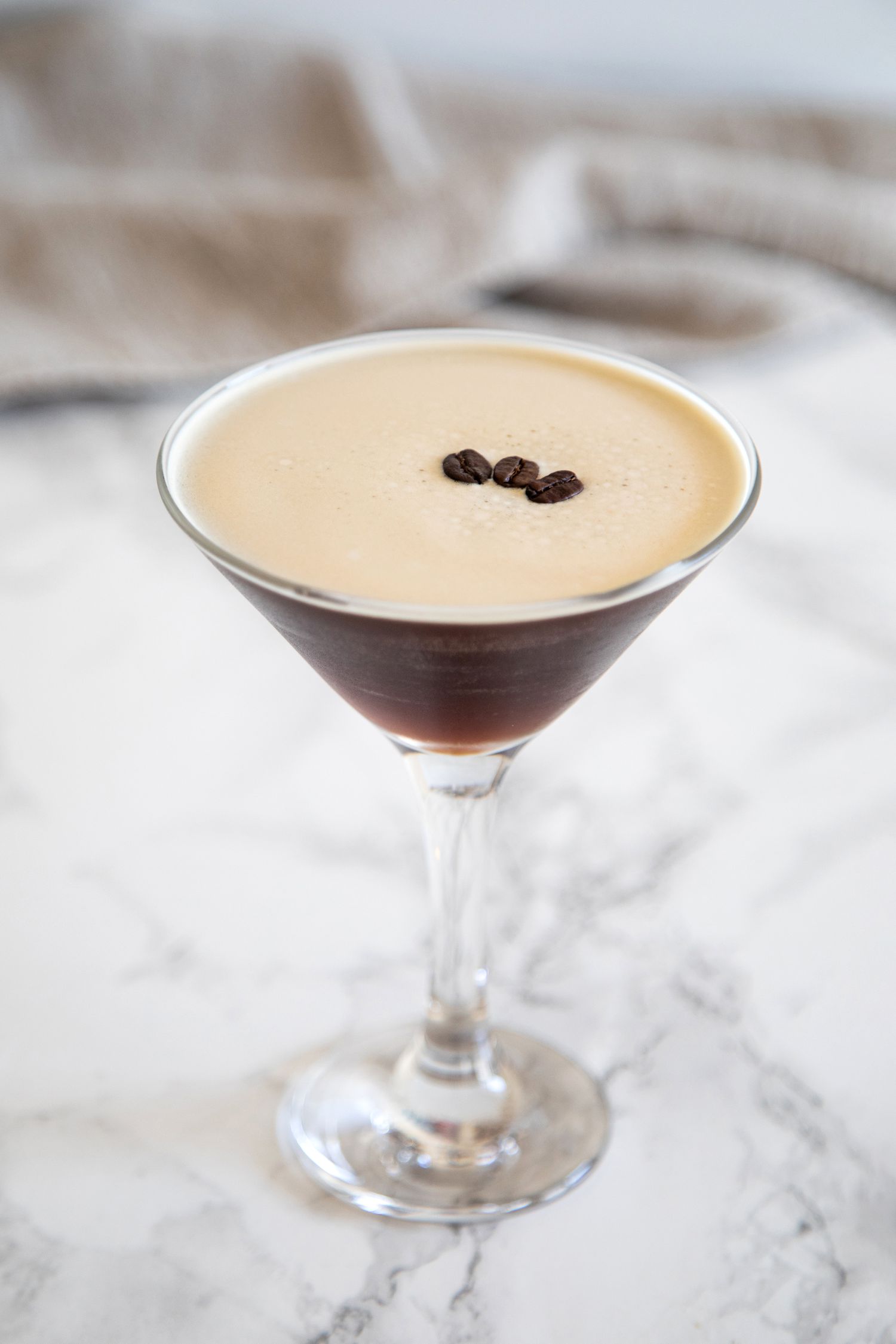 Espresso Martini Cocktail on a marble background.
