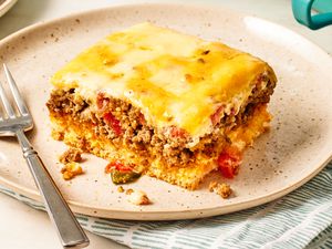 slice of Cattle Drive Casserole on a plate with a fork