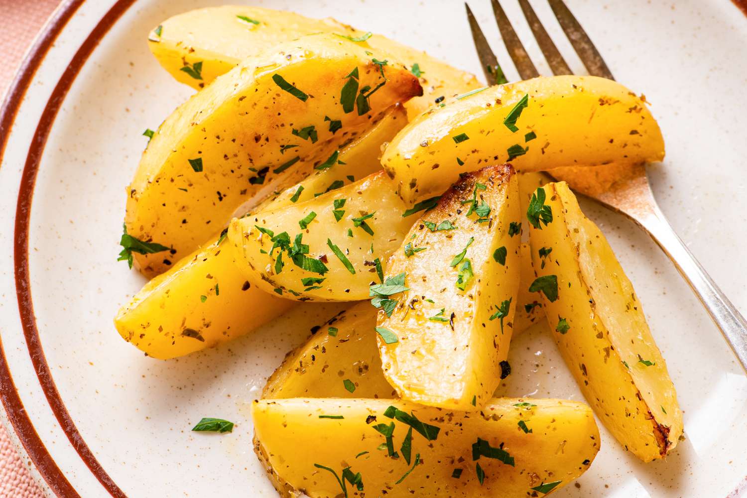 greek lemon potatoes on a small plate