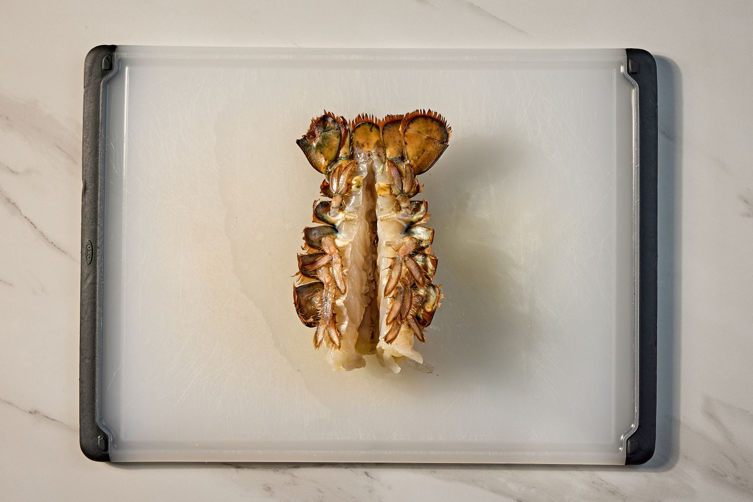 Overhead view of the lobster after cracking and ready for cooking for Baked Lobster Dip