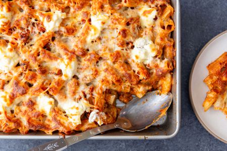 Italian Sausage Pasta Bake in a dish with a serving scooped out