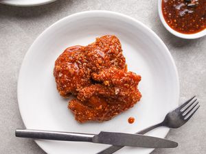 Honey honey chicken on white plate.