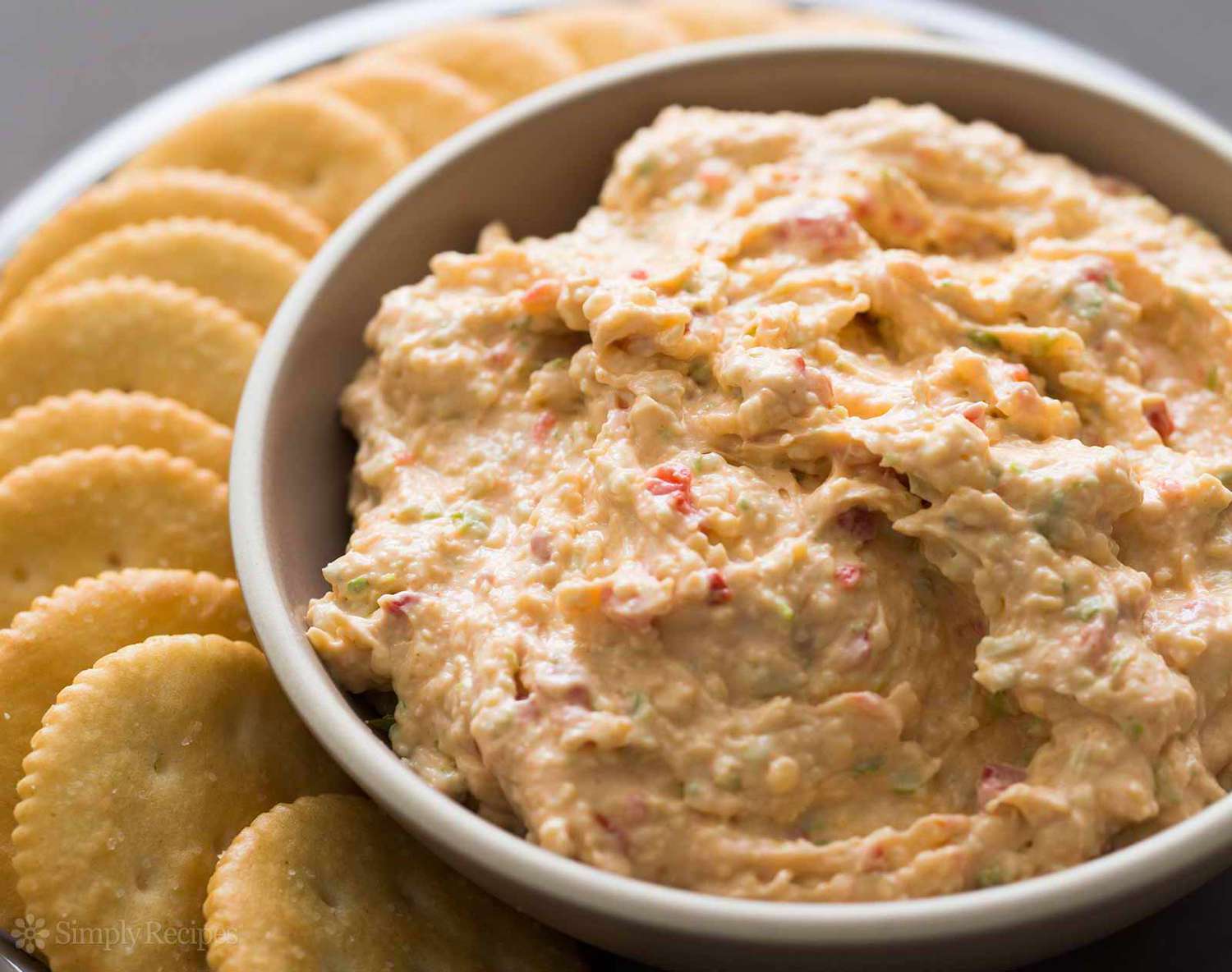 Pimento Cheese in bowl surrounded by crackers