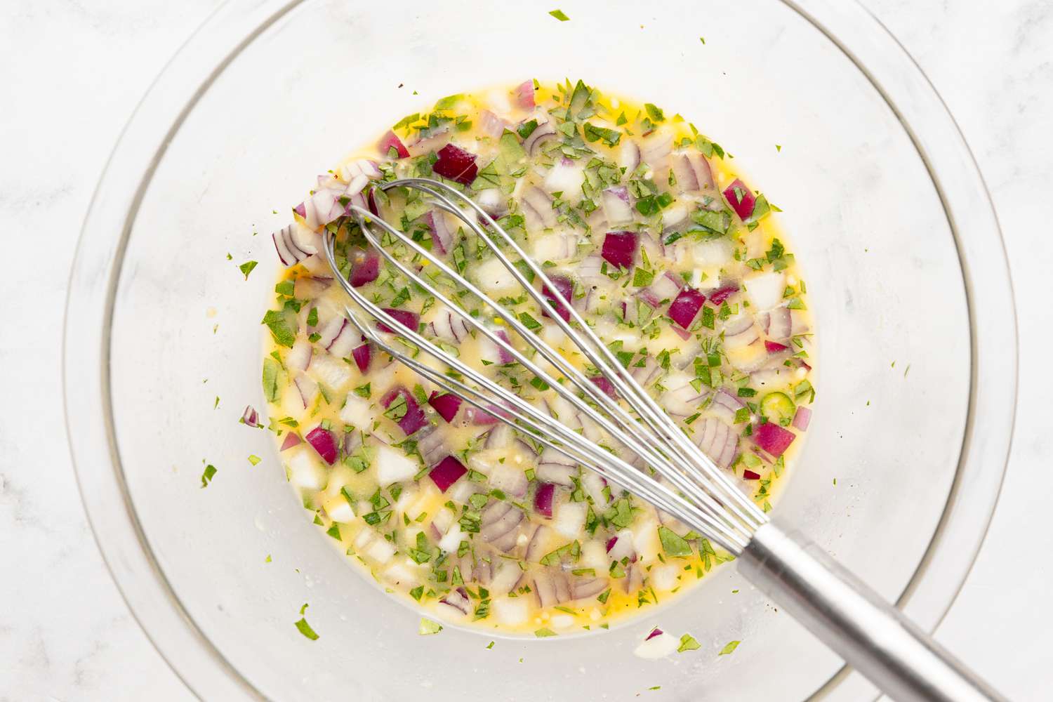 Onions, Curry Leaves, and Peppers Added to Spicy Coconut Ginger Omelette Mix