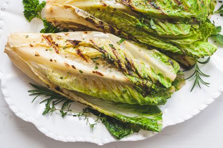 A platter of whole romaine in a romaine salad.