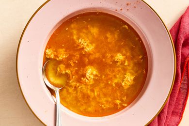 Sopa de Ajo in a bowl with a spoon