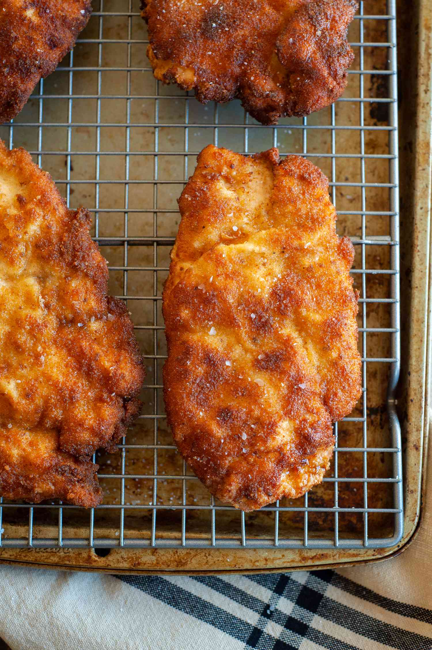 chicken schnitzel on baking sheet