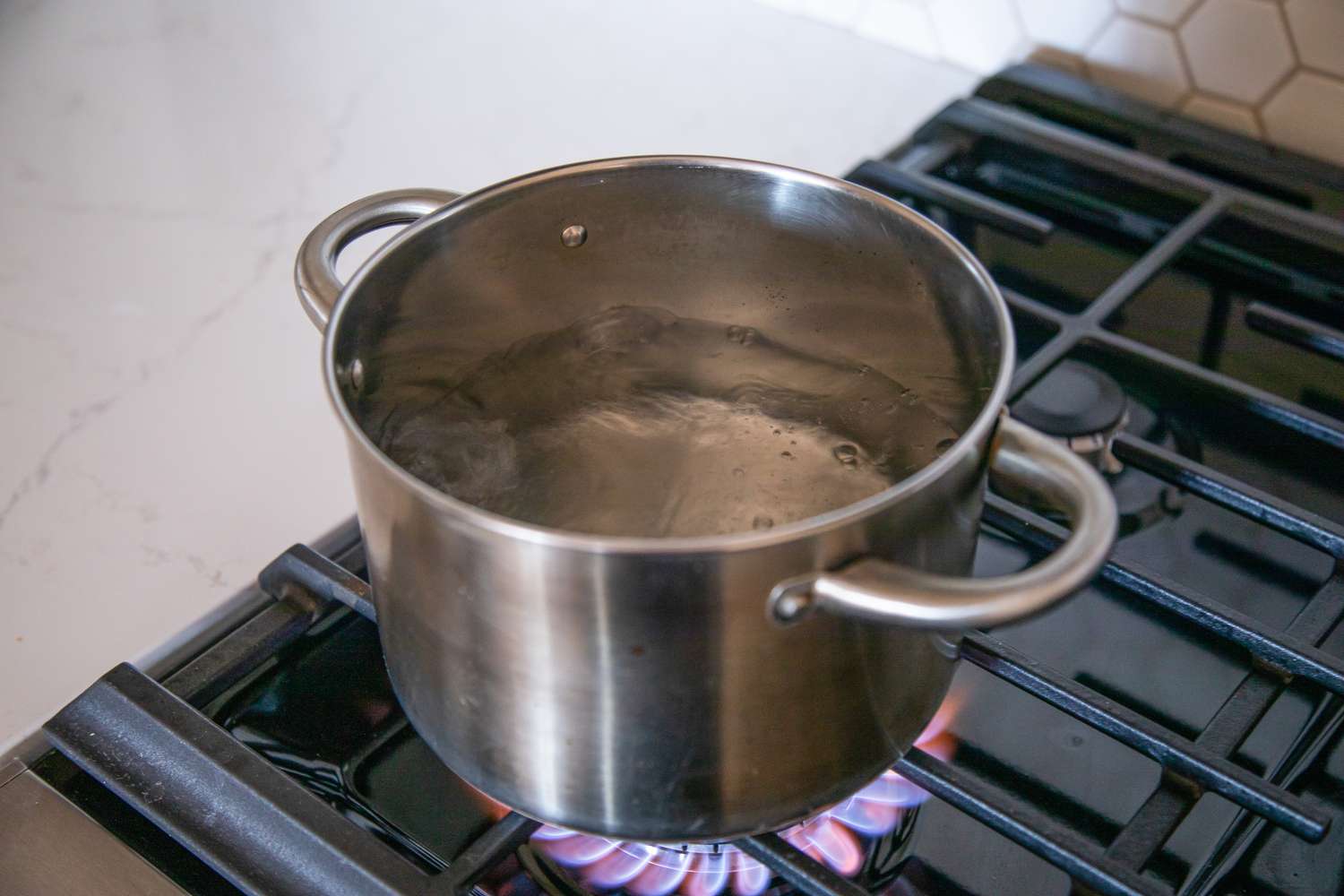Bot of Water Boiling on a Gas Stove for How to Blanch Broccoli