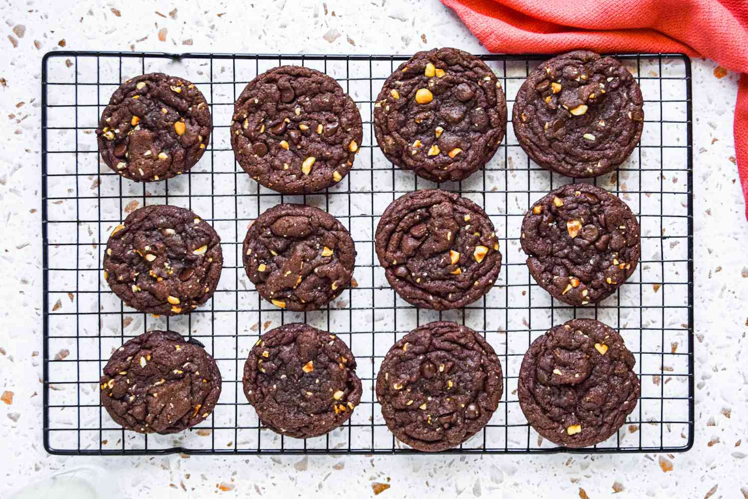 Chocolate nutella cookies cooling on a rack.