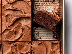 Devil's food cake in a baking pan (sliced and one slice facing up to show cross-section)