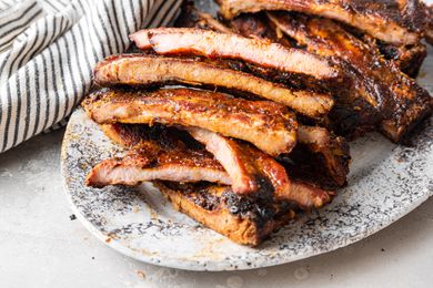 Memphis-Style Pork Ribs Cut into Pieces on a Platter