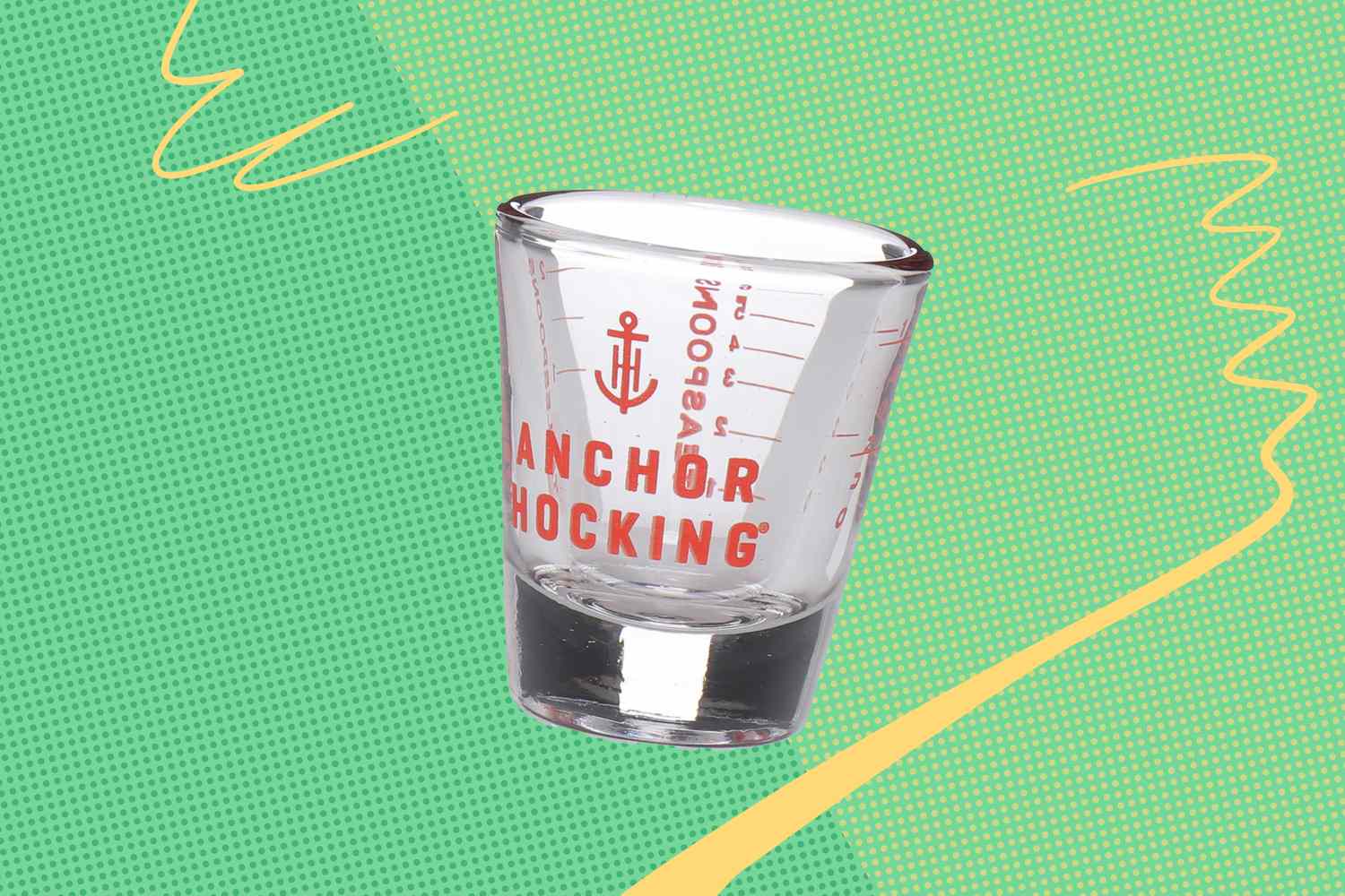 Anchor Hocking measuring shot glass shown on a decorative background