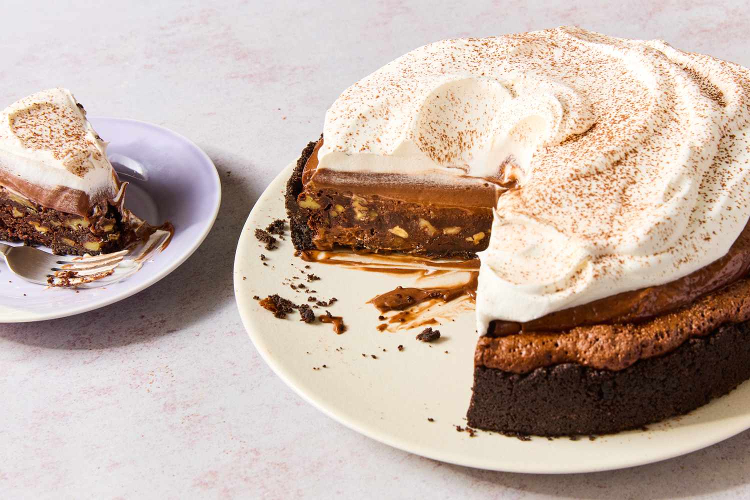 mississippi mud pie on a plate with a slice of pie on a plate next to it for mississippi mud pie recipe