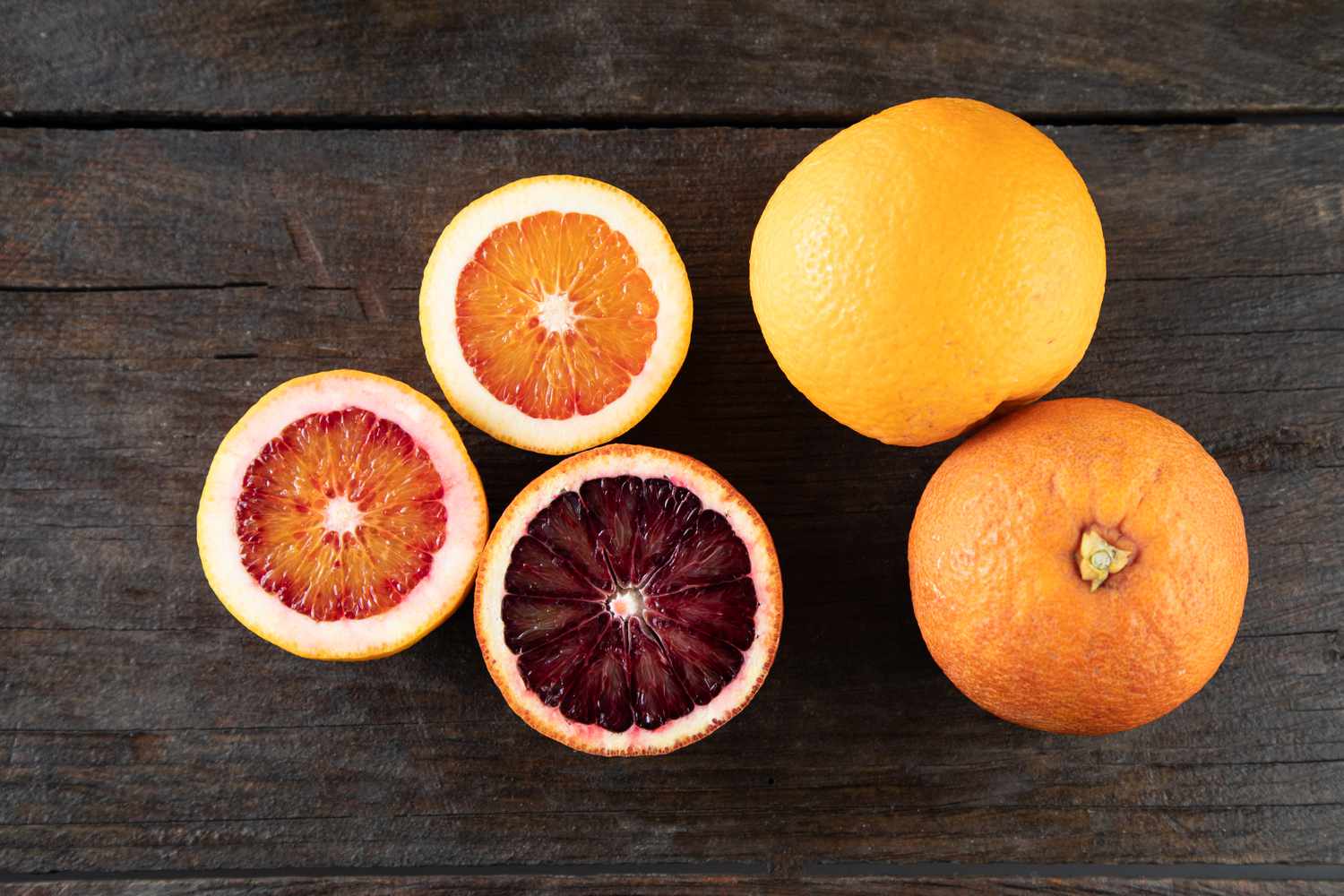 Blood oranges on dark background