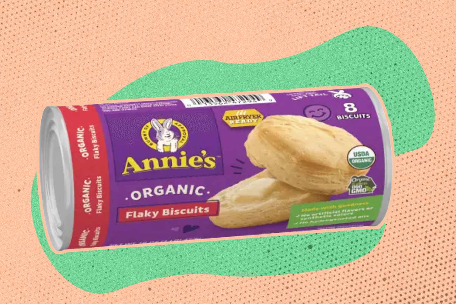 A roll of Annie's flaky biscuits on an illustrated background