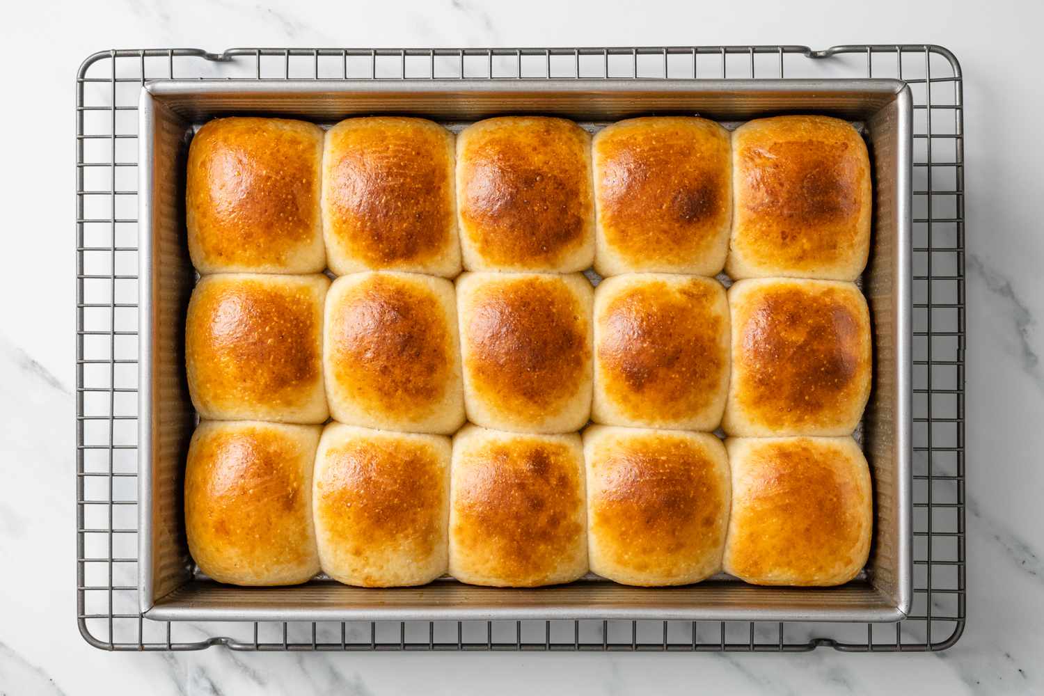 Baked Sourdough Rolls (in Pan) Resting on Cooling Rack