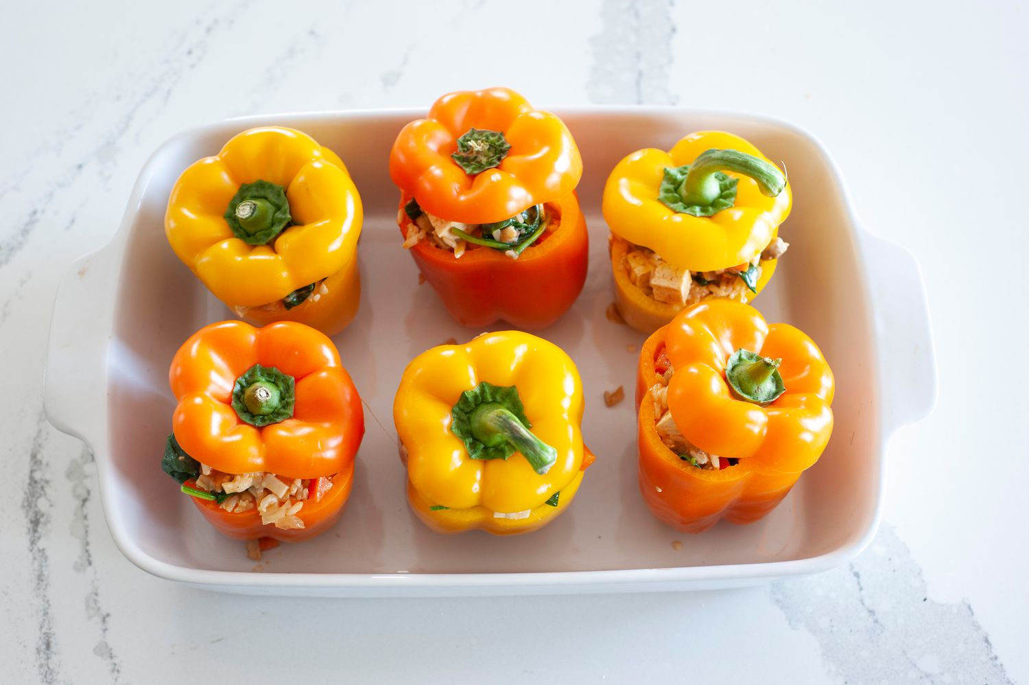 Vegetarian Stuffed Peppers in casserole dish