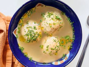 Matzo ball soup in a bowl