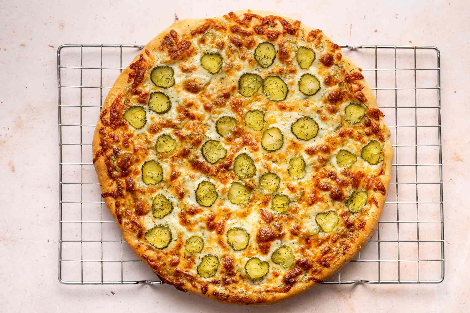 Baked pickle pizza before slicing