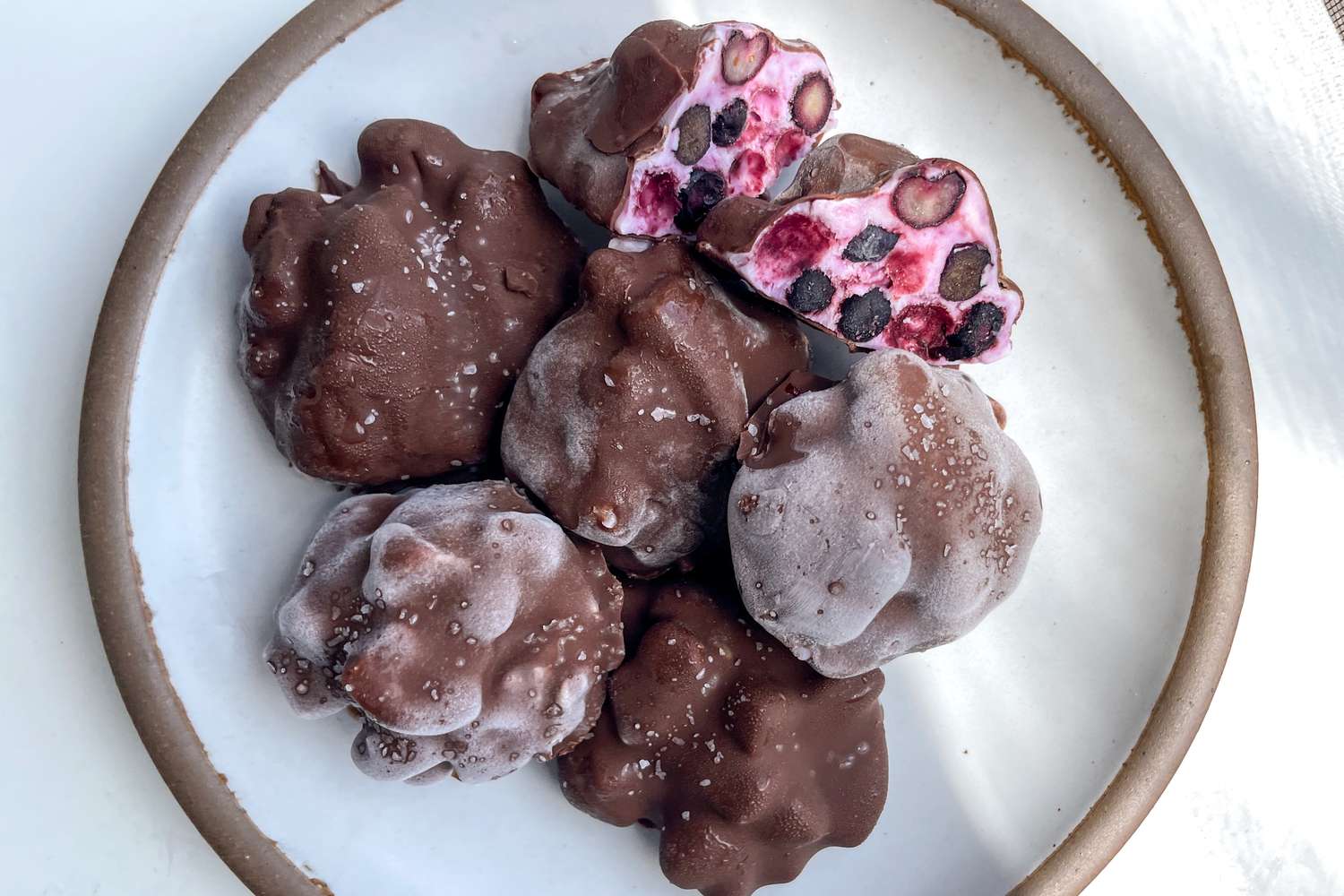 chocolate covered blueberry yogurt clusters on a plate