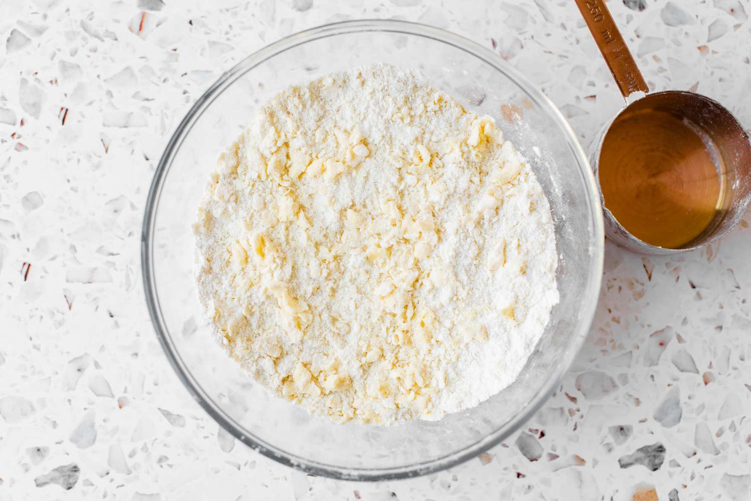 Butter Cut into Pea Sized Pieces and Mixed with Dry Ingredients for Easy Strawberry Shortcake Recipe