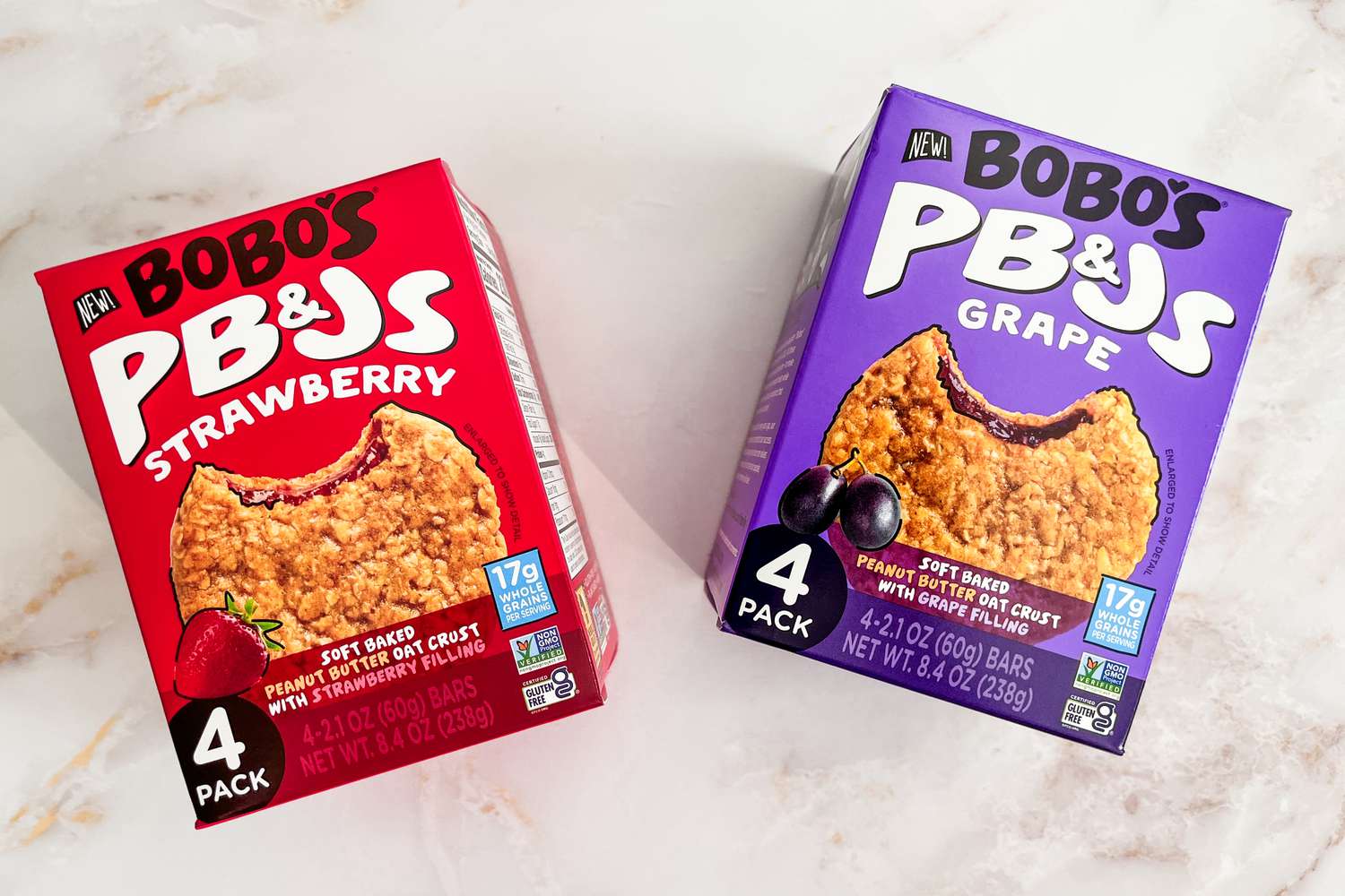 Boxes of Bobo's PB&Js boxes, strawberry and grape, sitting on a white surface