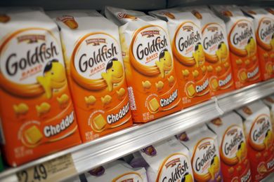 Packages of Goldfish cheddar crackers displayed on a grocery store shelf