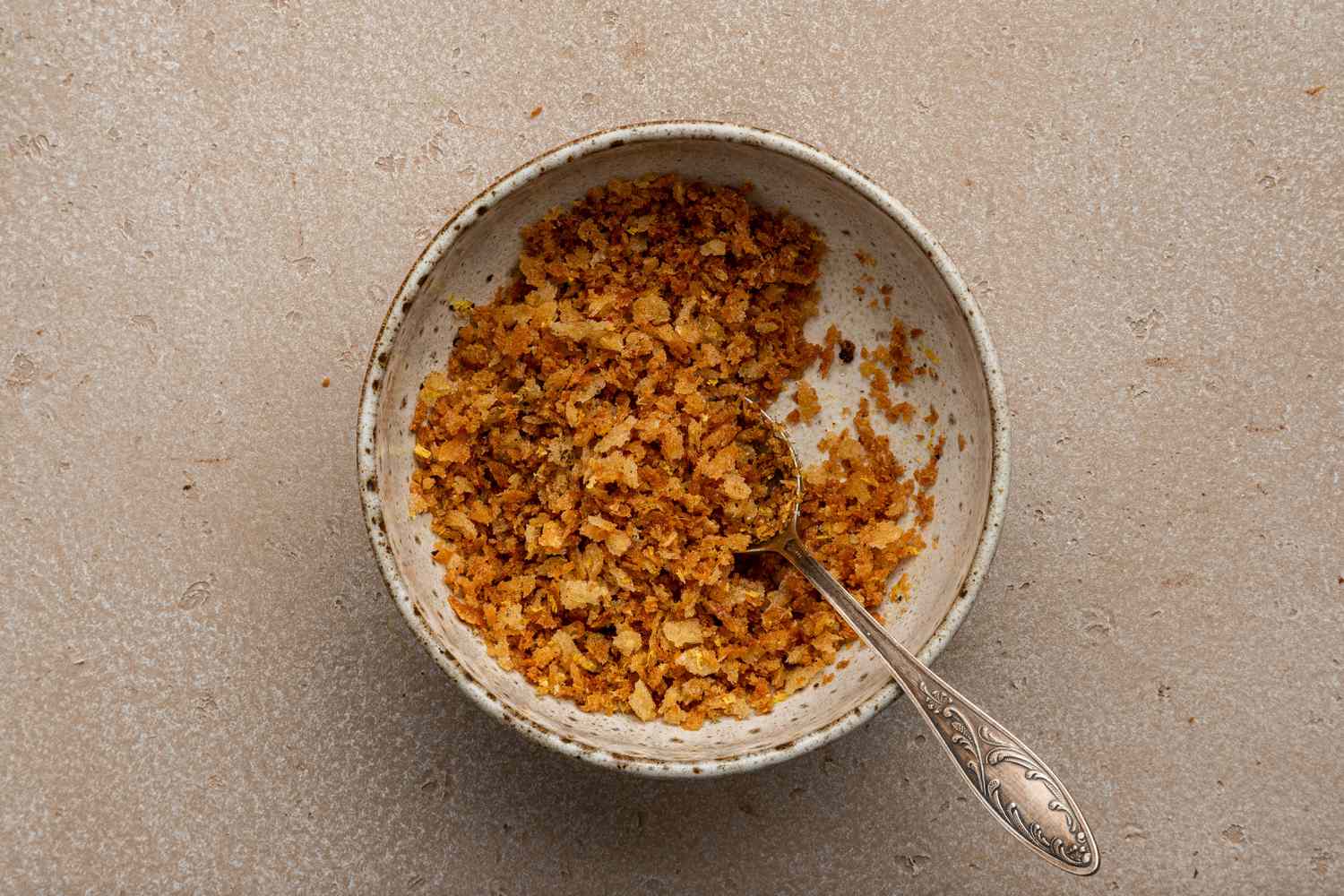 Bow of Lemony Breadcrumbs Mixed with a Spoon
