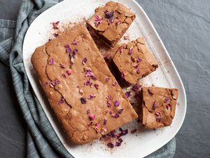 Spiced brownies on a white platter.