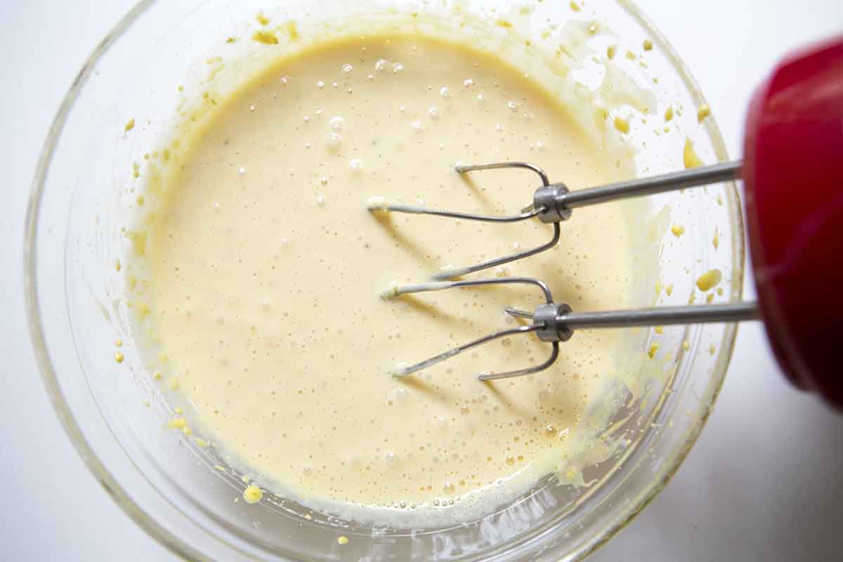 Mixing the key lime pie filling with a hand mixer