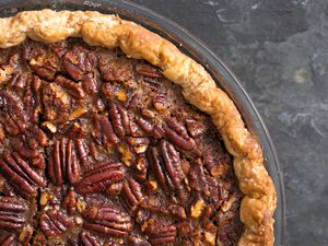 Close up of a baked pecan pie filling.