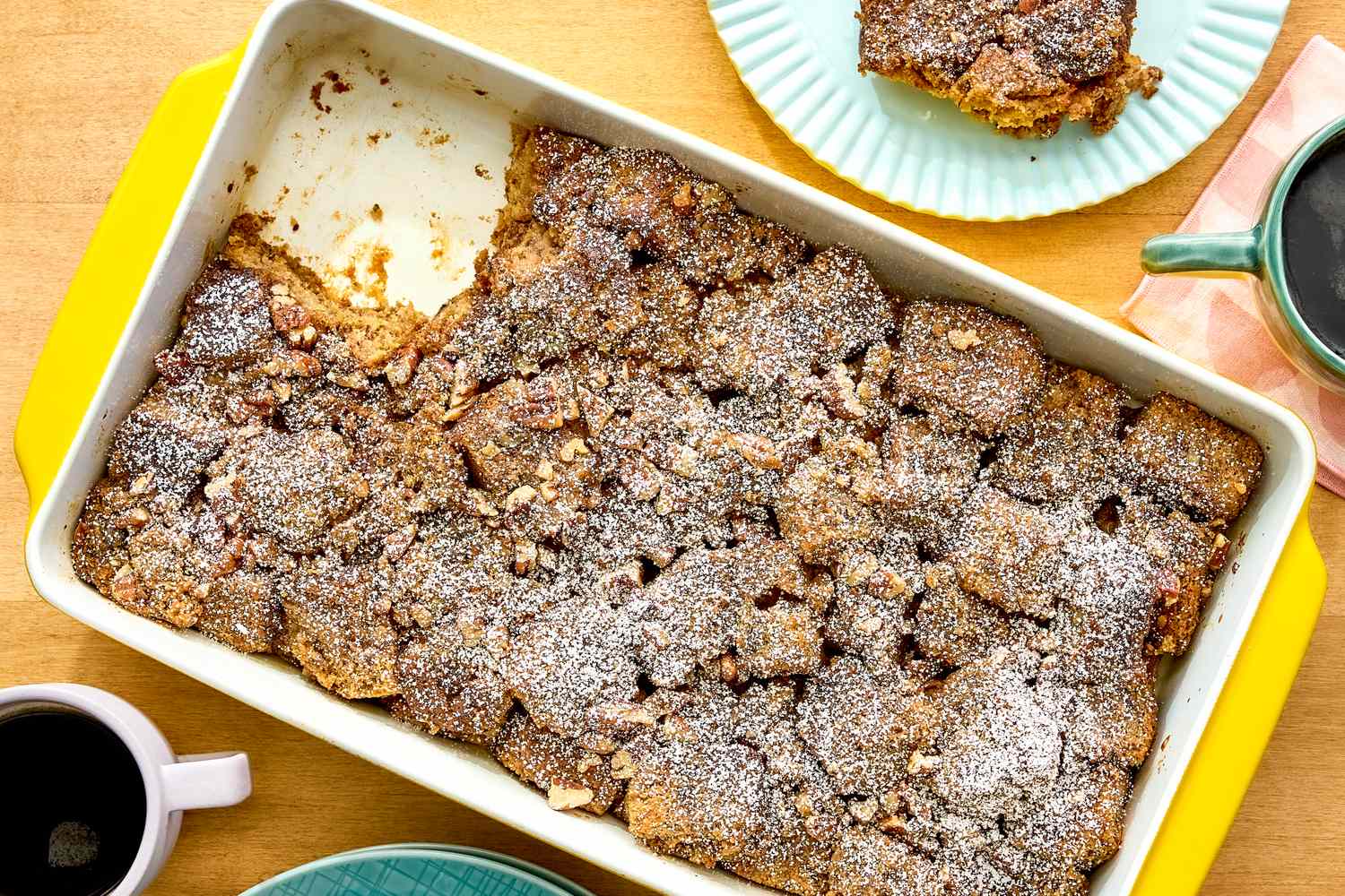 Banana bread breakfast casserole in a yellow baking dish on a table