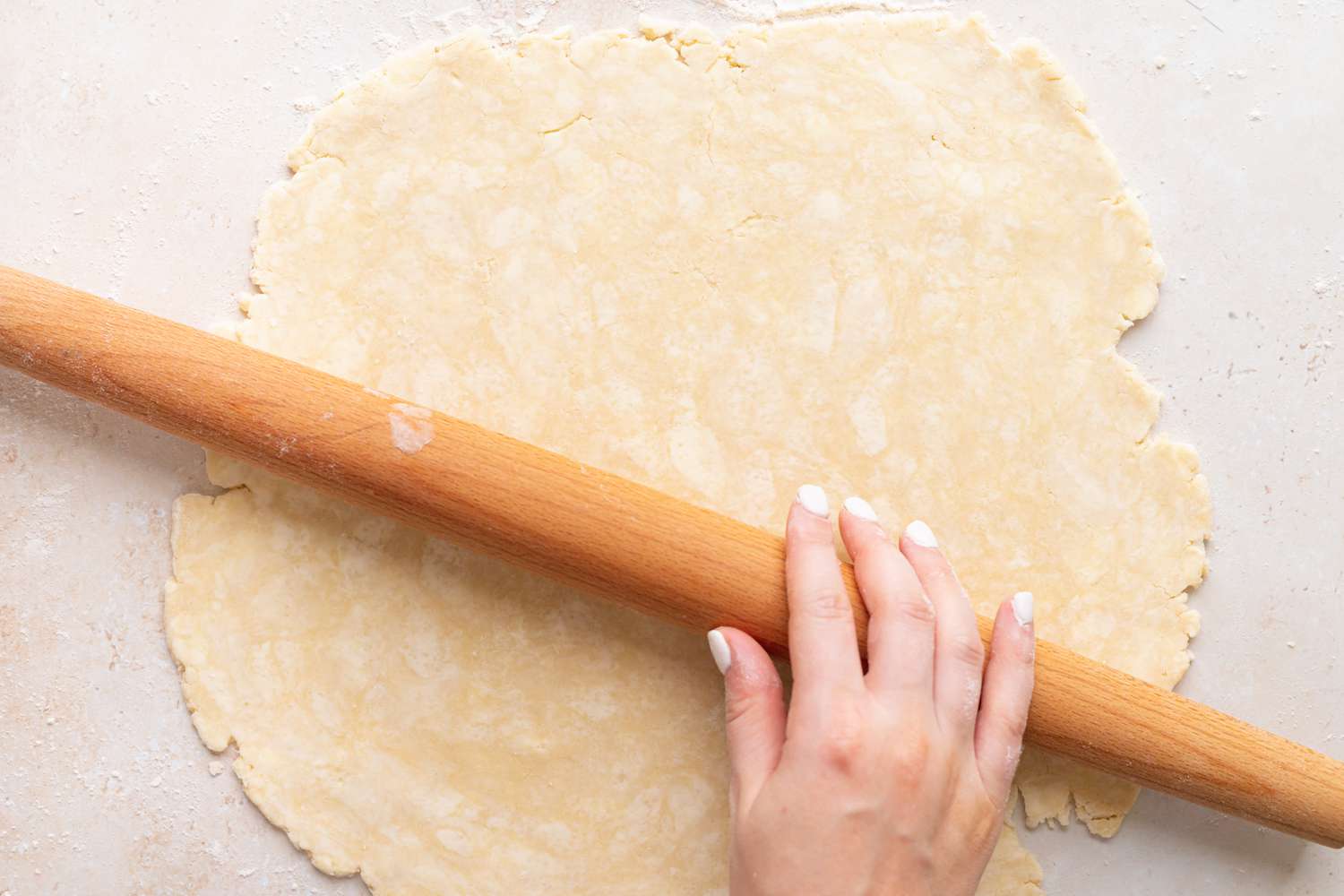 Rolling out the dough for a summer peach and raspberry pie.