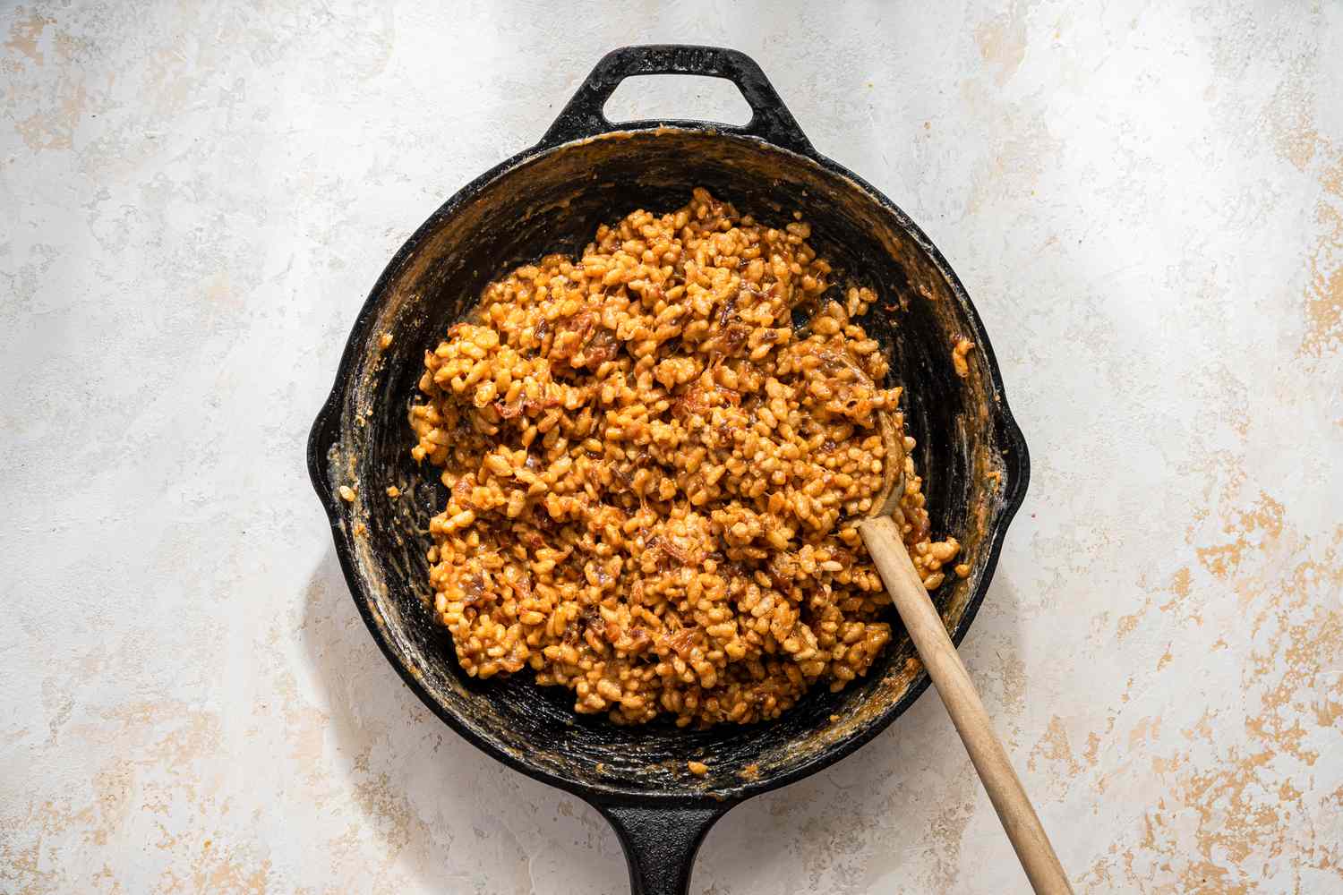 Rice cereal added to the date-sugar paste in the cast iron skillet for date skillet cookies recipe