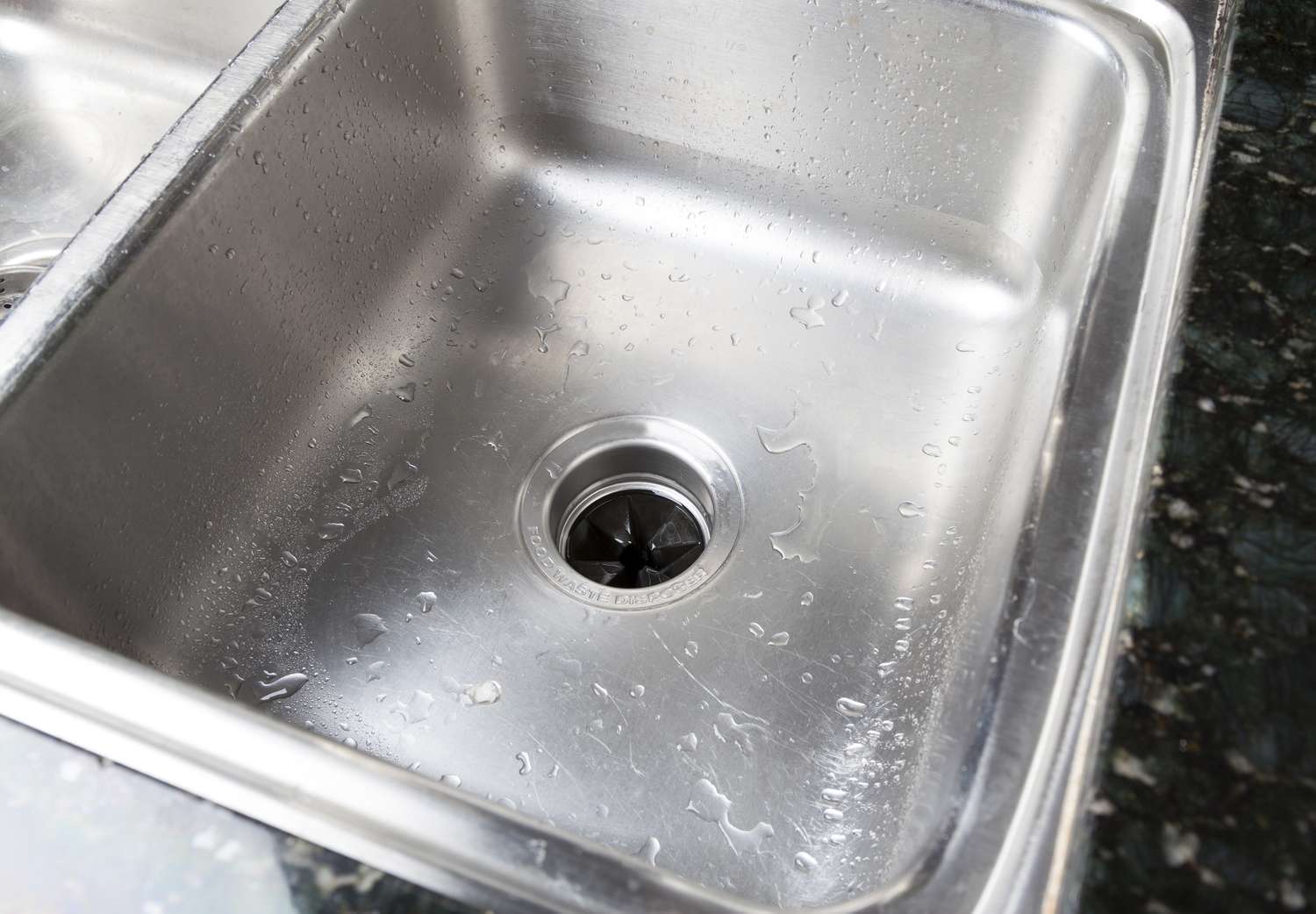 Stainless steel sink with a garbage disposal