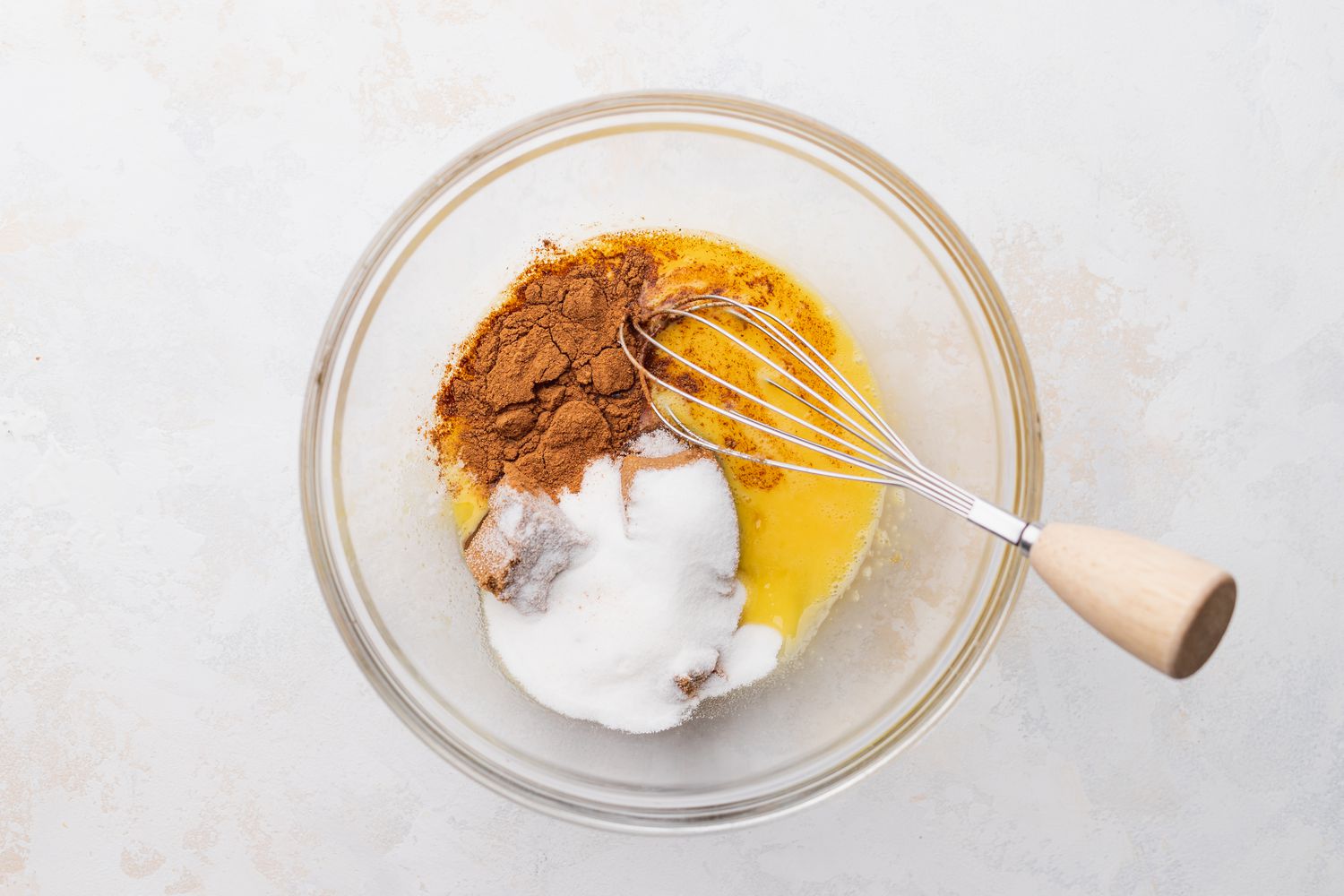 Bowl of Sugar, Brown Sugar, and Cinnamon with a Whisk for Old Fashioned Pumpkin Pie Recipe